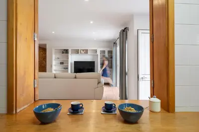 two blue bowls sitting on a table in a living room at Fontinha by An Island Apart in Porto Santo