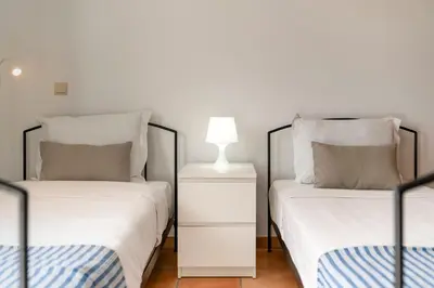 two beds sitting next to each other in a bedroom at Fontinha by An Island Apart in Porto Santo