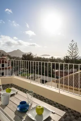 a balcony with a table and a view at Fontinha by An Island Apart in Porto Santo