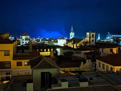 a view of a city skyline at night at Top-Floor One-Bedroom Flats - Peaceful with Ocean and City Views in Funchal