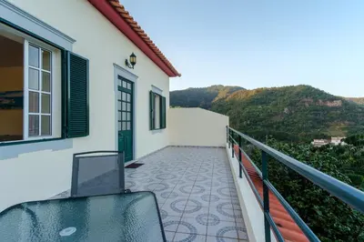 a balcony with a view of a mountain at GuestReady - A charming experience in Madeira in Machico
