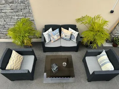 an overhead view of a patio with couches and a coffee table at Alforra Residence 2-Centro-Praias-Levadas in Câmara de Lobos