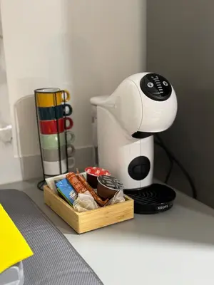 a coffee maker on a counter with a box of food at Alforra Residence 2-Centro-Praias-Levadas in Câmara de Lobos