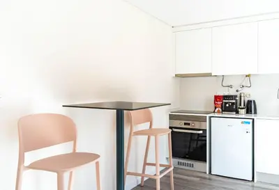 a kitchen with a table and two chairs at Terrace in Carmo in Funchal