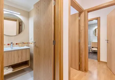 a bathroom with a sink and a mirror at Lux Girassol - Two Bedroom Apartment in Caniço