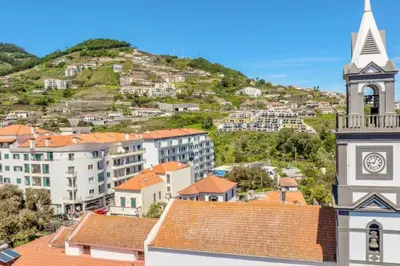 a view of a town with a clock tower at Lux Girassol - Two Bedroom Apartment in Caniço