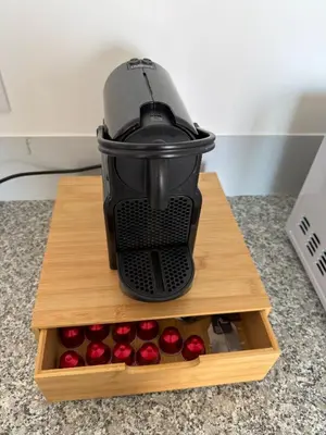 a blender sitting on top of a cutting board with red apples at Vivenda Silva in Seixal