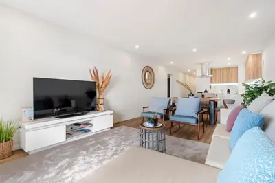 a living room with a flat screen tv and a living room at Sunset Vista 604 in Funchal