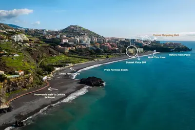 an aerial view of a beach with buildings and the ocean at Sunset Vista 604 in Funchal