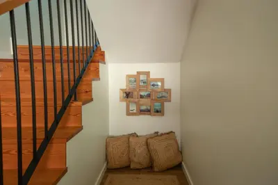 a staircase in a home with a stair case at Villa Eden Sky in Prazeres in Prazeres