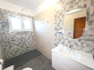 a bedroom with a bed with two towels on it at RODRIGUES ViLLA in Funchal
