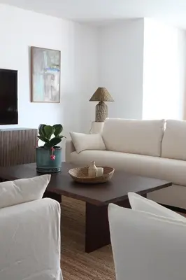 a living room with a white couch and a coffee table at Heart of Funchal 4 BD Apartment - Casa d Alma in Funchal