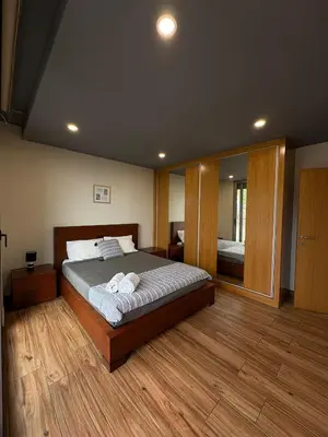 a bedroom with a bed with two towels on it at Sunset Valley House in Ribeira Brava