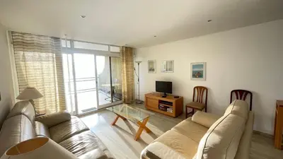 a living room with a couch and a television at Sea Haven in Funchal
