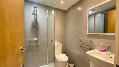 a bathroom with a shower and a toilet and a sink at Sea Haven in Funchal
