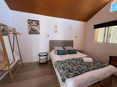 a bedroom with a bed in a room at Chalet Abacates in Estreito da Calheta