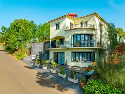 a house with potted plants on the side of a road at Oxford apartment Alpine escape villa in Gaula