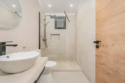 a bathroom with a sink and a toilet and a shower at Oxford apartment Alpine escape villa in Gaula