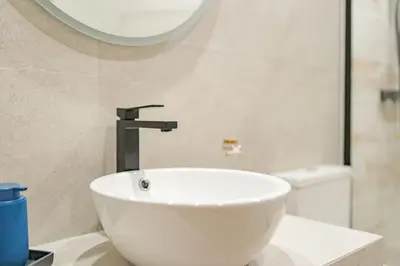 a white sink in a bathroom with a shower at Oxford apartment Alpine escape villa in Gaula