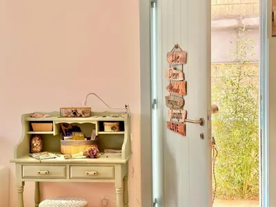 a room with a table with a drawer and a door at Casa Bamboo in Porto Santo