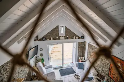 an overhead view of a living room with a large window at Casa Neverland in Vila Baleira