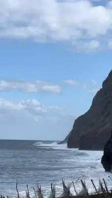 a beach with a view of the ocean at Taverna in São Jorge