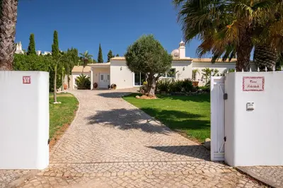 a driveway leading to a house with two refrigerators at 804 Quinta Felicidade in Lagos