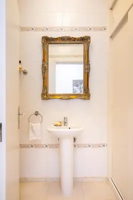 a bathroom with a sink and a mirror at 804 Quinta Felicidade in Lagos
