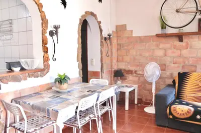 a dining room with a table and chairs at Casa do Careca in Sagres