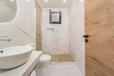 a bathroom with a sink and a toilet and a shower at Santiago apartment Alpine escape villa in Gaula