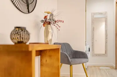a living room with a chair and a table at Santiago apartment Alpine escape villa in Gaula