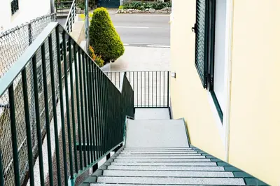 a stairway leading up to a building at Panoramic Attic by Sabugo House in Relógio do Poiso