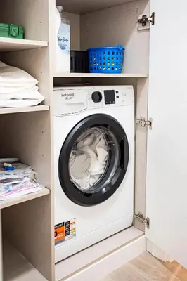 a washer and dryer in a utility room at Panoramic Attic by Sabugo House in Relógio do Poiso