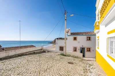 a house with a view of the ocean at Beach Apt 1 In Burgau in Burgau