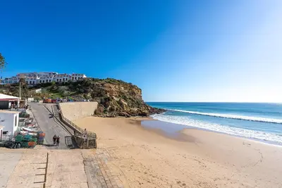 a view of a beach with the ocean at Beach Apt 1 In Burgau in Burgau