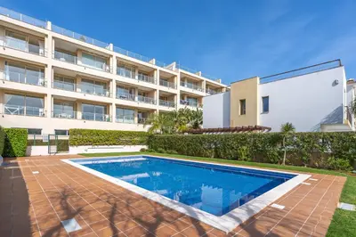 an image of a swimming pool in front of a building at Apt Brightness Comfort In Burgau in Burgau