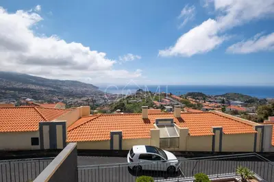 a white car parked in front of a house at Casa do Pico by GALMI in Funchal