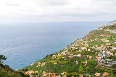 a village on a hill next to the ocean at Ana's View, cozy apartment, AC, sea view & parking in Arco da Calheta