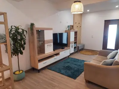 a living room with a tv and a couch at Apartment Studio Espiche near Praia da Luz in Luz