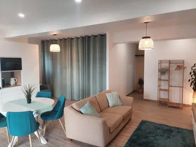 a living room with a couch and a table at Apartment Studio Espiche near Praia da Luz in Luz