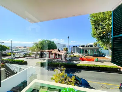 an open balcony with a view of a street at Flor do Lido in Funchal