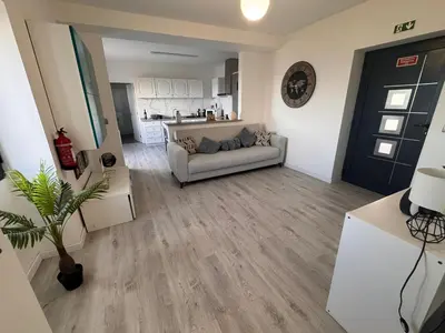 a living room with a couch and a table at LOV - Lombadinha Ocean View in Gaula