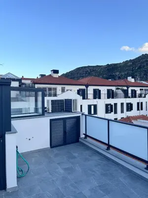 a balcony with a view of some buildings at Private 1 bedroom house in Machico Centre in Machico