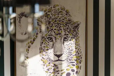 a painting of a jaguar in a frame at GuestReady - Breathtaking seaview in Caniço in Caniço