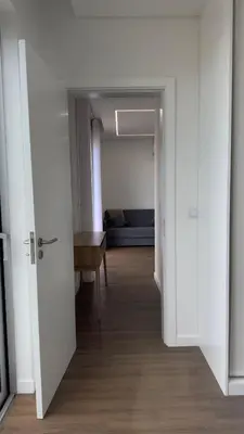 a hallway with a door leading to a bedroom at Like Home I - vista mar e ambiente relaxante in Funchal