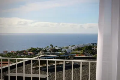 a view of the ocean from a balcony at Like Home I - vista mar e ambiente relaxante in Funchal