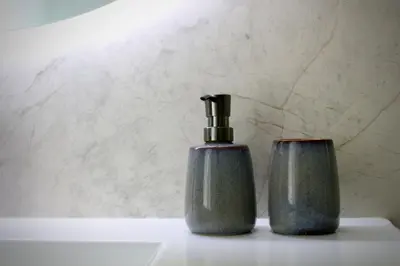 two soap dispensers sitting on a bathroom counter at Like Home I - vista mar e ambiente relaxante in Funchal