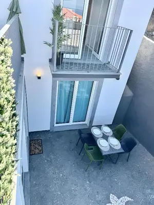 an overhead view of a balcony with a table and chairs at Casa Do Tempo com Jacuzzi in Ribeira Brava