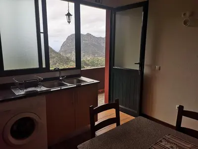 a kitchen with a sink and a view of a mountain at House in the montain Casa do Cabeço in Machico