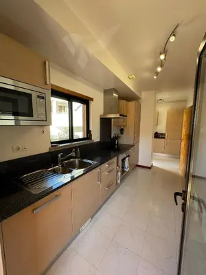 a kitchen with a sink and a microwave at Praia da Luz - Resort in Luz